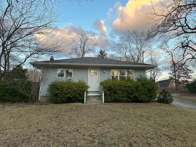 view of front of home with a lawn