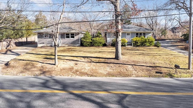 single story home featuring a carport