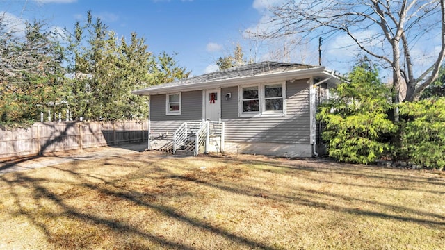 view of front of home with a front lawn