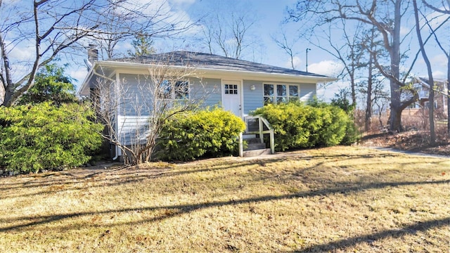 view of front of home with a front yard