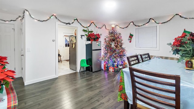 dining area with dark hardwood / wood-style floors