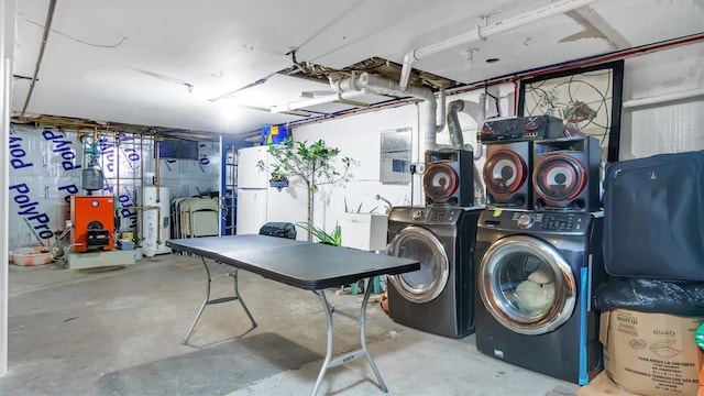 interior space featuring washing machine and clothes dryer and water heater