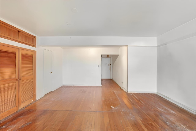 spare room with hardwood / wood-style flooring