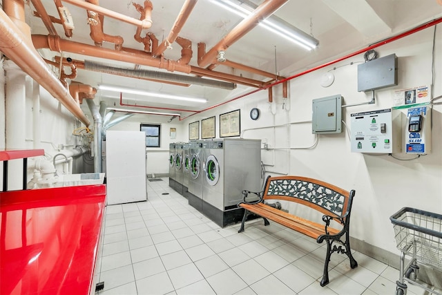 washroom featuring independent washer and dryer and electric panel