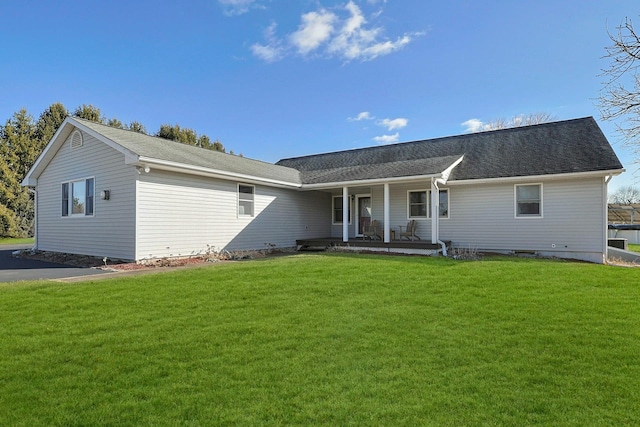 single story home with a porch and a front lawn