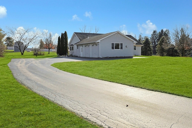 view of property exterior with a yard and a garage