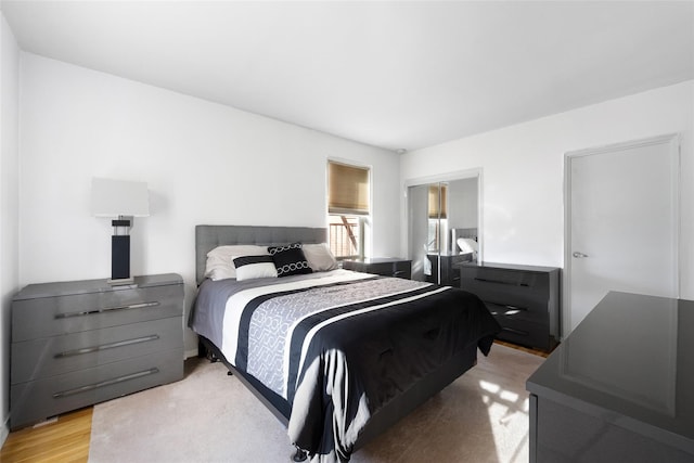 bedroom featuring light wood-style flooring