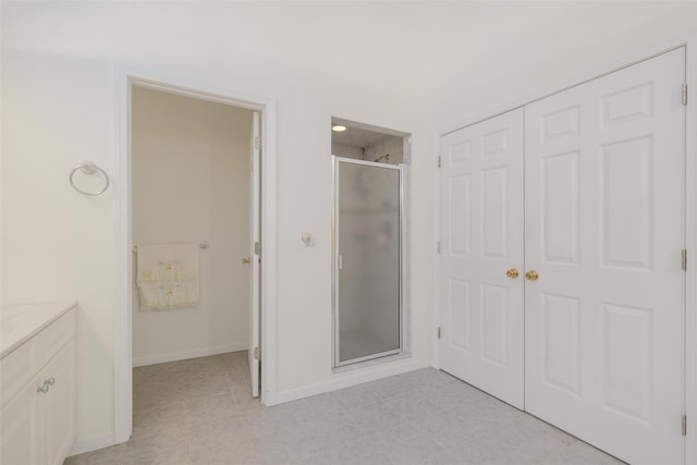 bathroom featuring vanity, tile patterned floors, and an enclosed shower