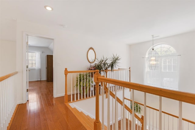 hallway with light hardwood / wood-style flooring