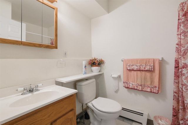 bathroom featuring vanity, toilet, and a baseboard heating unit