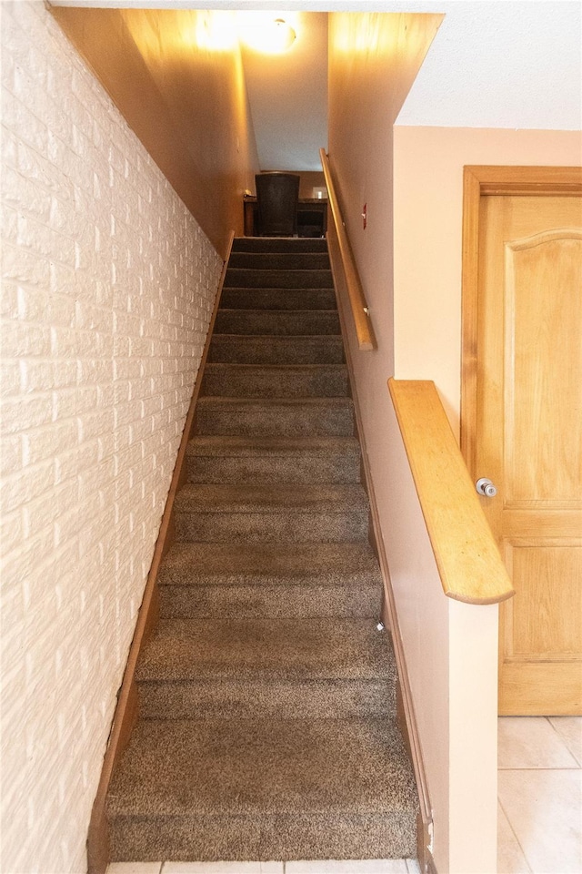 staircase with tile patterned flooring