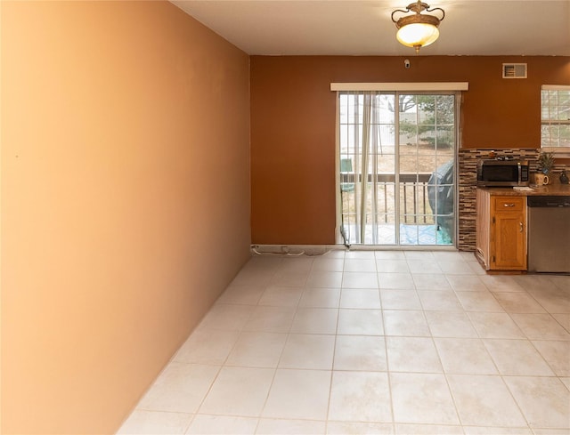 interior space featuring light tile patterned floors