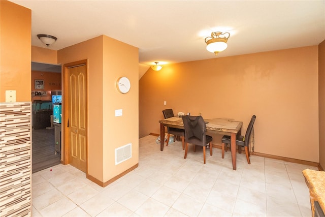 dining area featuring light tile patterned floors