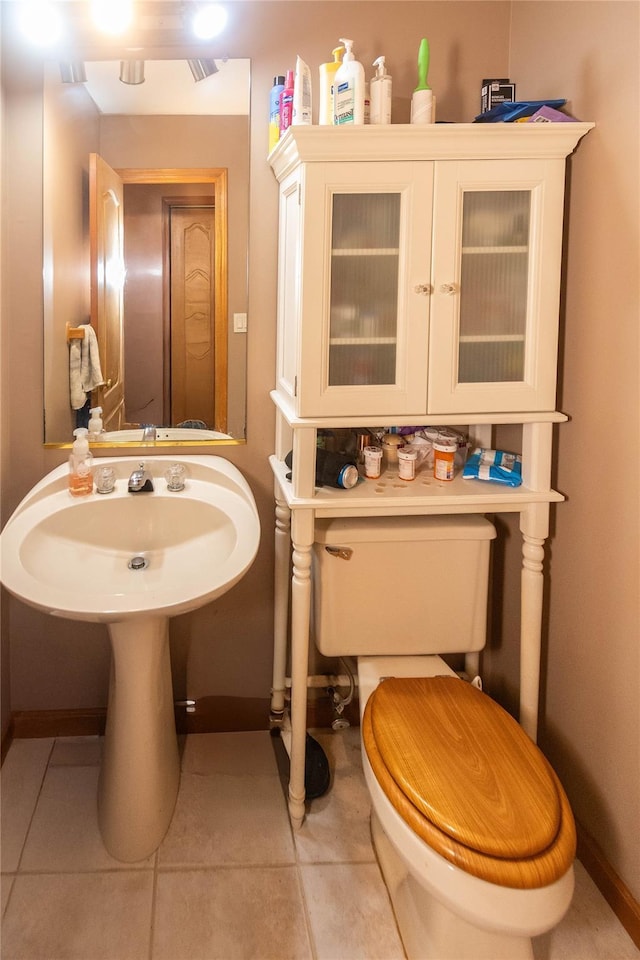 bathroom with tile patterned floors and toilet