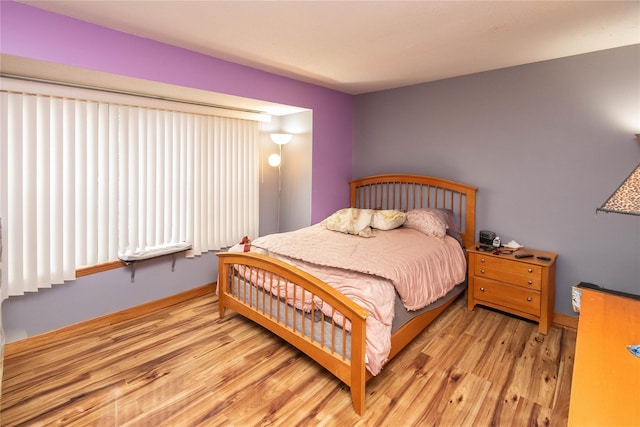 bedroom featuring light wood-type flooring