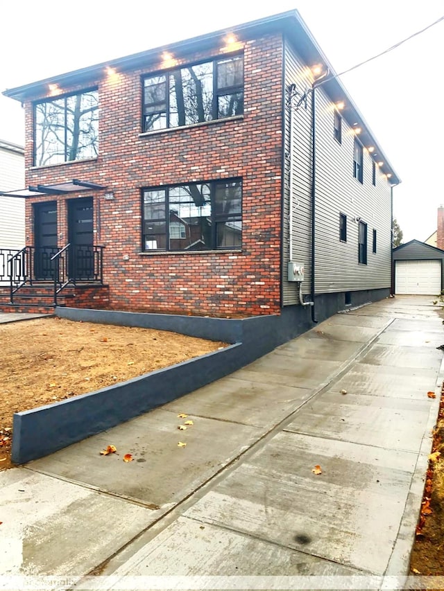 view of side of property featuring an outdoor structure and a garage