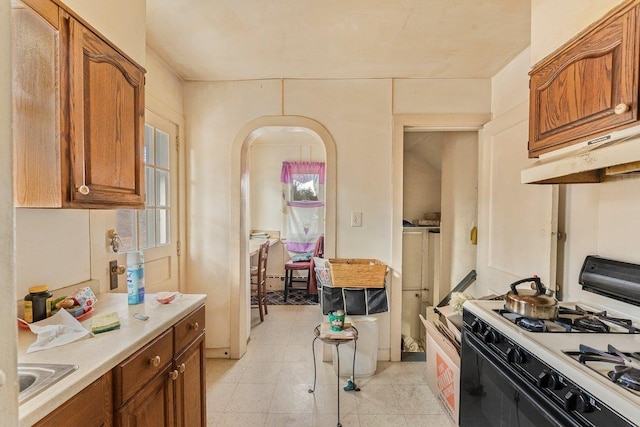 kitchen with white gas range