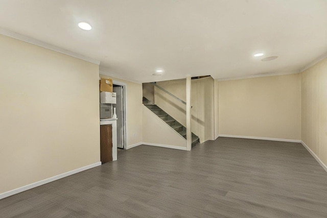 interior space featuring ornamental molding and dark wood-type flooring