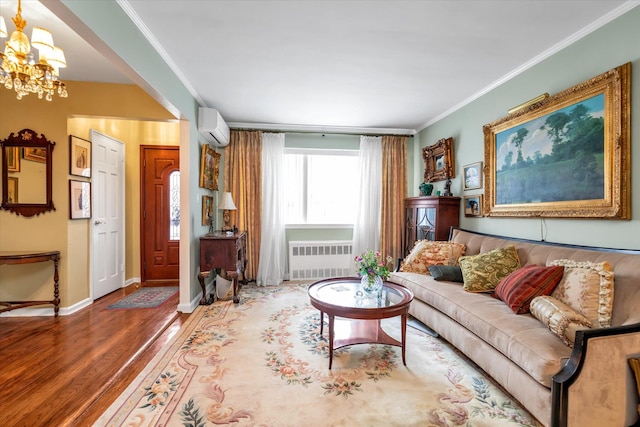 living room featuring a notable chandelier, a wall unit AC, crown molding, hardwood / wood-style flooring, and radiator