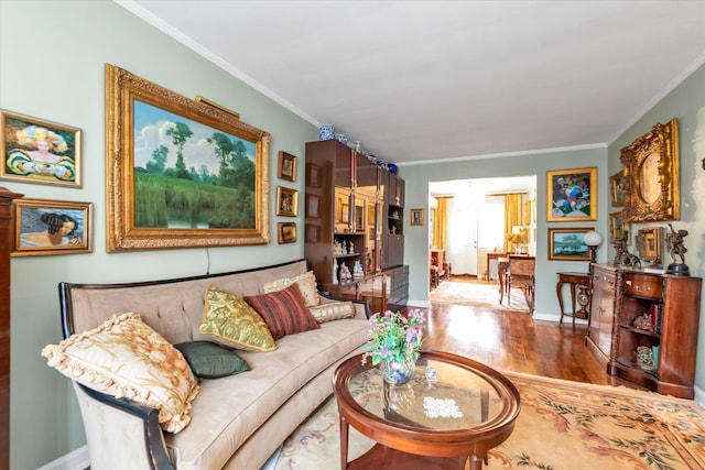 living room featuring hardwood / wood-style floors and crown molding