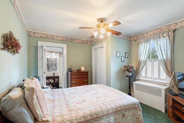 bedroom featuring a closet, dark carpet, radiator, and ceiling fan