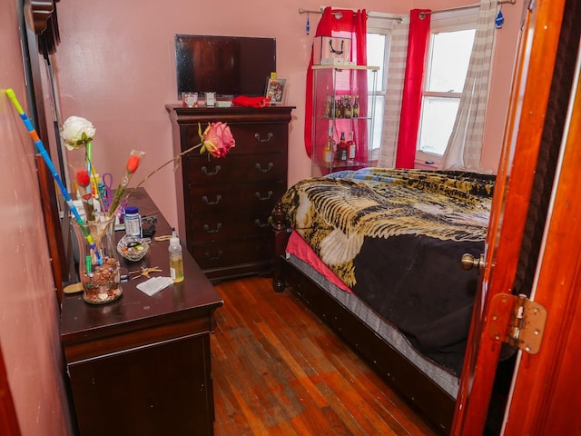 bedroom featuring dark wood-type flooring