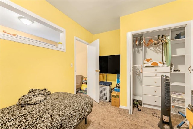 bedroom featuring light colored carpet