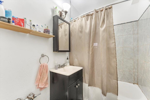 bathroom featuring vanity and shower / bath combo