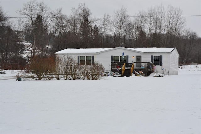 manufactured / mobile home with a wooden deck