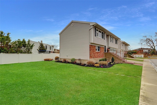 view of property exterior with a yard