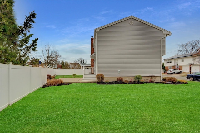 view of property exterior featuring a lawn