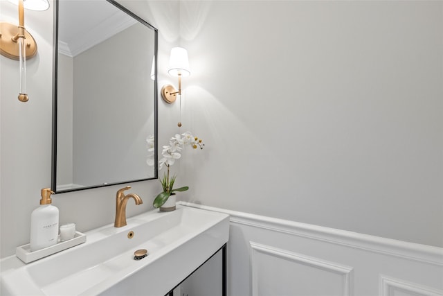 bathroom with vanity and crown molding