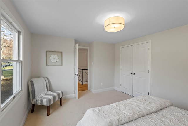 carpeted bedroom with a closet