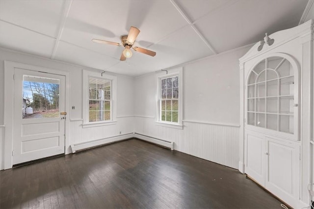 interior space featuring ceiling fan, dark hardwood / wood-style flooring, a healthy amount of sunlight, and a baseboard radiator