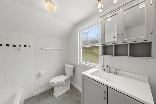 full bathroom with tile patterned floors, tub / shower combination, vanity, toilet, and lofted ceiling