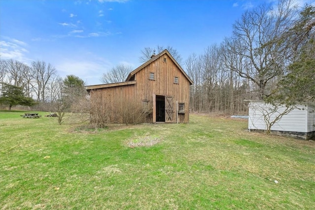 view of outdoor structure with a yard