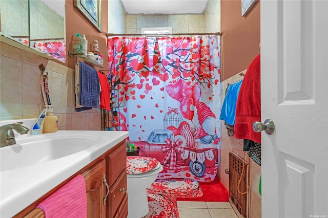 bathroom featuring tile patterned flooring, toilet, vanity, tile walls, and a shower with shower curtain