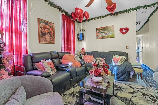 tiled living room with ceiling fan