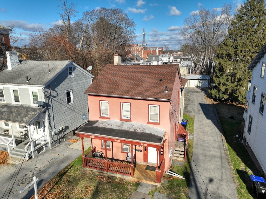 rear view of house with covered porch