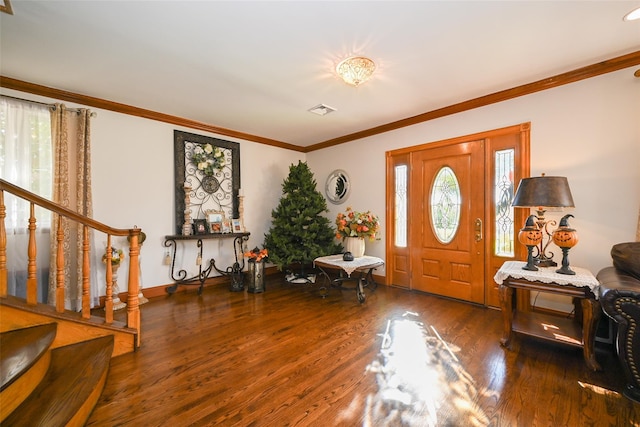 foyer with dark hardwood / wood-style flooring and ornamental molding