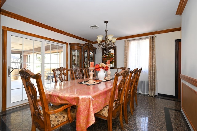 dining space featuring a wealth of natural light, a chandelier, and ornamental molding