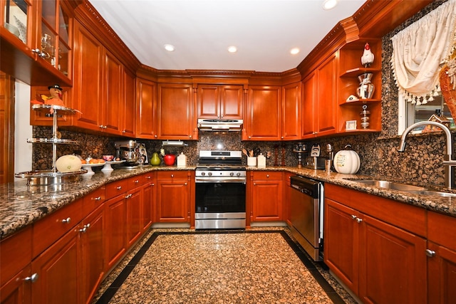 kitchen with appliances with stainless steel finishes, tasteful backsplash, dark stone counters, and sink