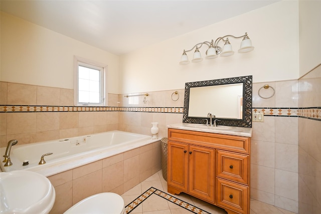 bathroom with tile patterned flooring, vanity, toilet, and tile walls