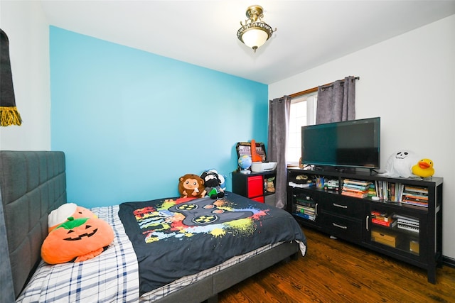 bedroom featuring dark hardwood / wood-style floors