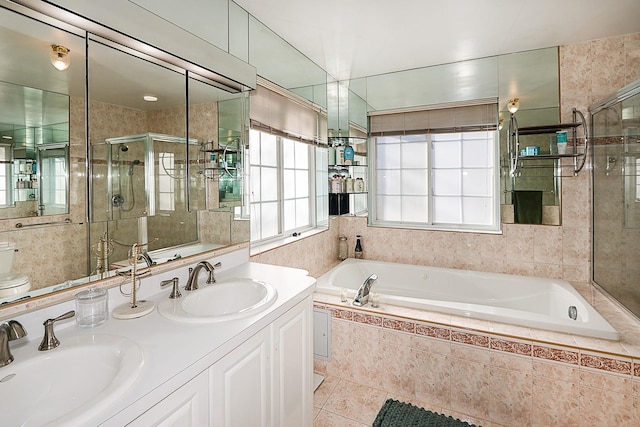 full bathroom featuring plus walk in shower, vanity, tile patterned floors, and toilet