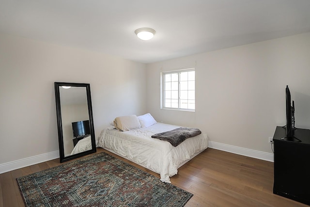 bedroom featuring wood-type flooring