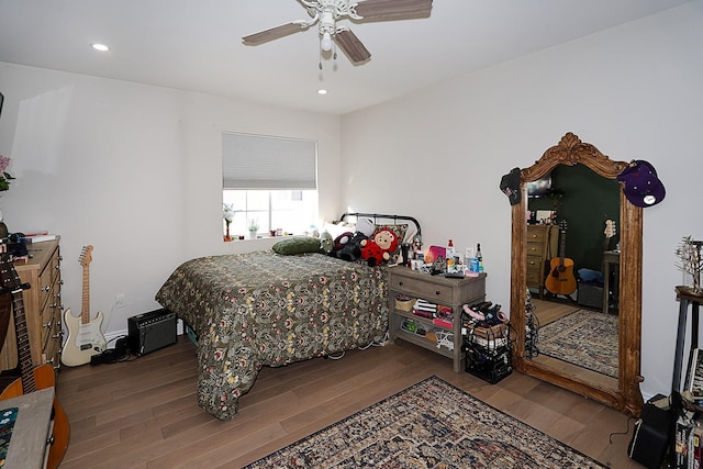 bedroom featuring ceiling fan and wood-type flooring