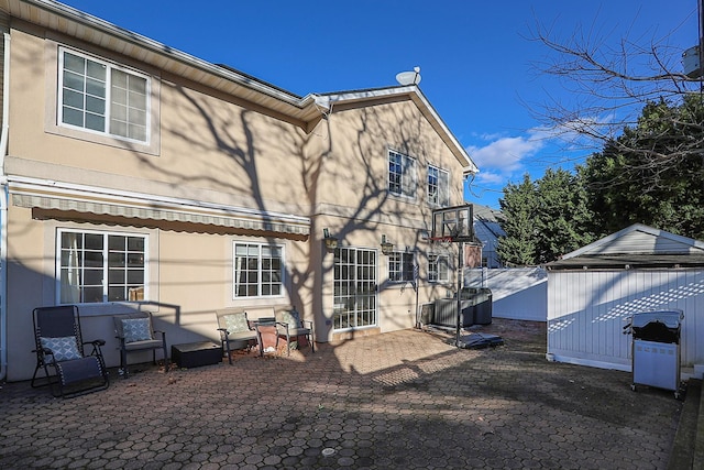 rear view of house featuring a patio