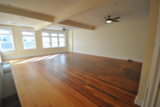 unfurnished room with beamed ceiling, dark hardwood / wood-style floors, and ceiling fan