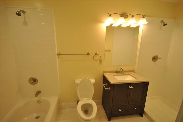 full bathroom featuring toilet, tile patterned flooring, vanity, and tiled shower / bath